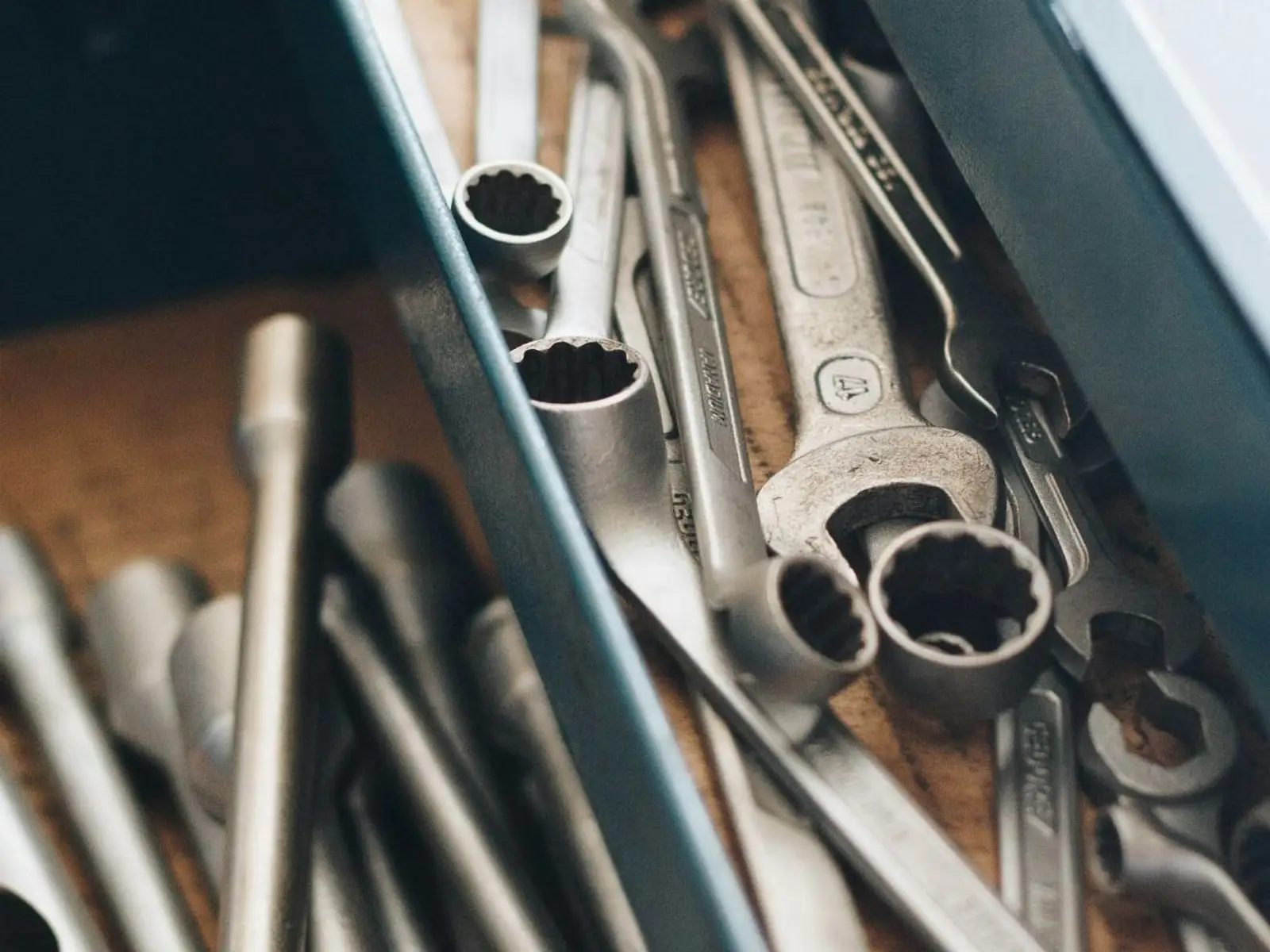 A drawer of well-used wrenches and sockets in the shop